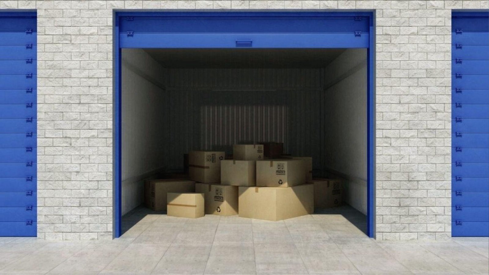 Open self-storage unit with blue doors filled with boxes for long term storage while awaiting new home