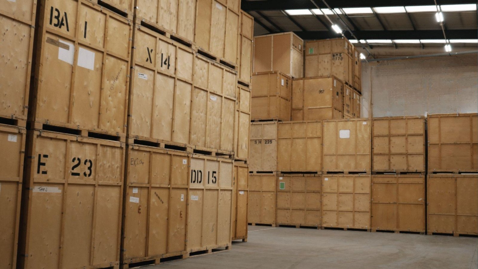 Large wooden storage vaults stacked high showing how movers store client belongings safely for months